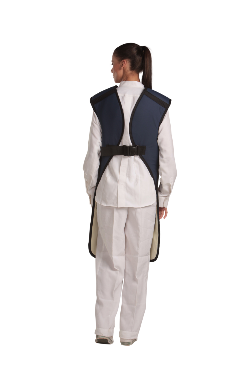 A rear view of a female model wearing a navy blue, beige-lined coat apron with flex back fastened.