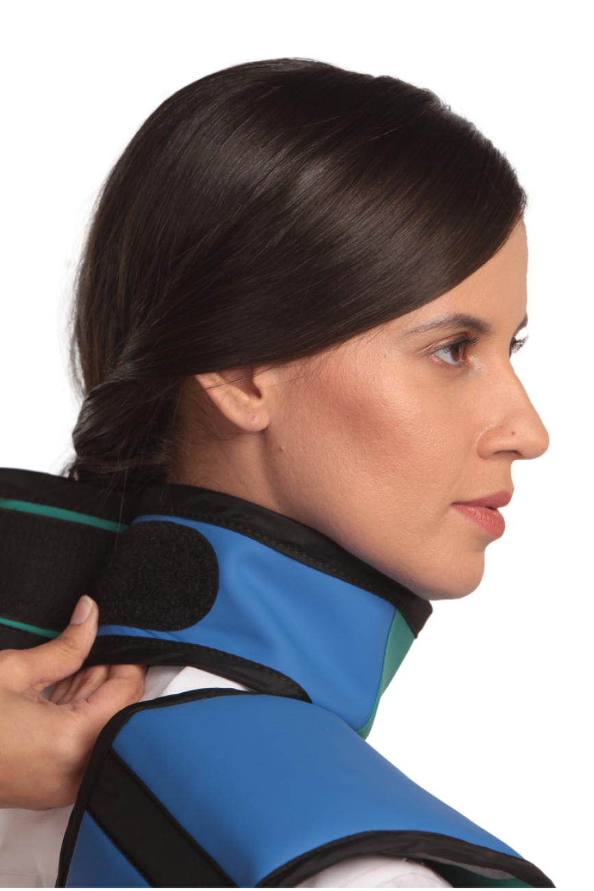 Up-close view of a Royal blue integrated thyroid guard being fastened onto the neck of a female model.