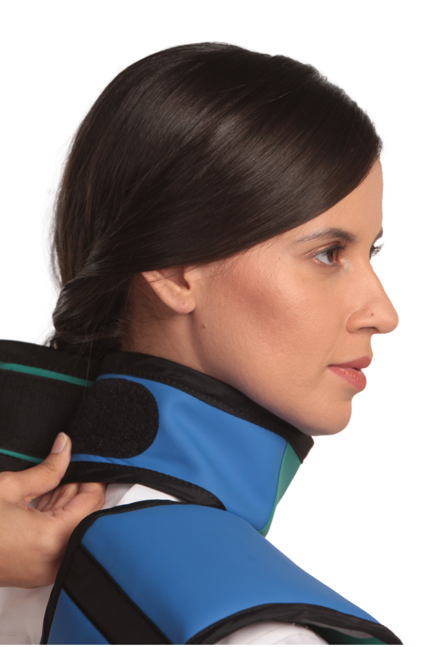 Up-close view of a Royal blue integrated thyroid guard being fastened onto the neck of a female model. 