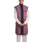 Full frontal view of a female model, her hands clasped together below her stomach, wearing a coat apron with integrated thyroid guard. The apron is mauve in color with a Jet black center line and has closed velcro fasteners by the sides.