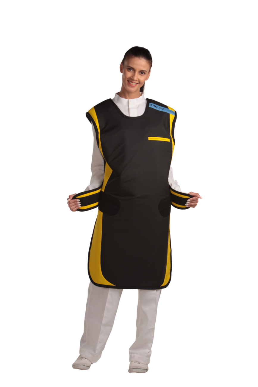 A full frontal view of a female model wearing a black, yellow-lined coat apron with flex back. The side velcro fasteners are unattached and held in her hands.