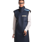A full frontal view of a female model wearing a navy blue, beige-lined coat apron with integrated thyroid guard. 