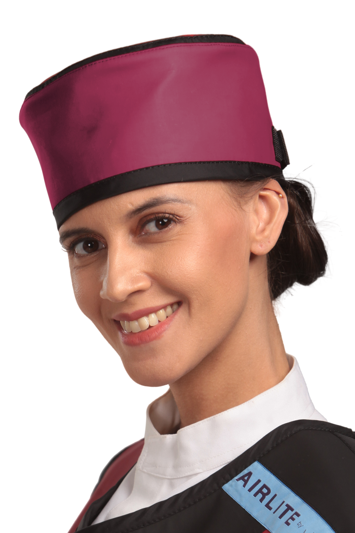 Up-close left-side frontal view of a female model wearing a radiation protection head shield. The head shield is Bordeaux red with black-colored lines around the lower and upper edges.