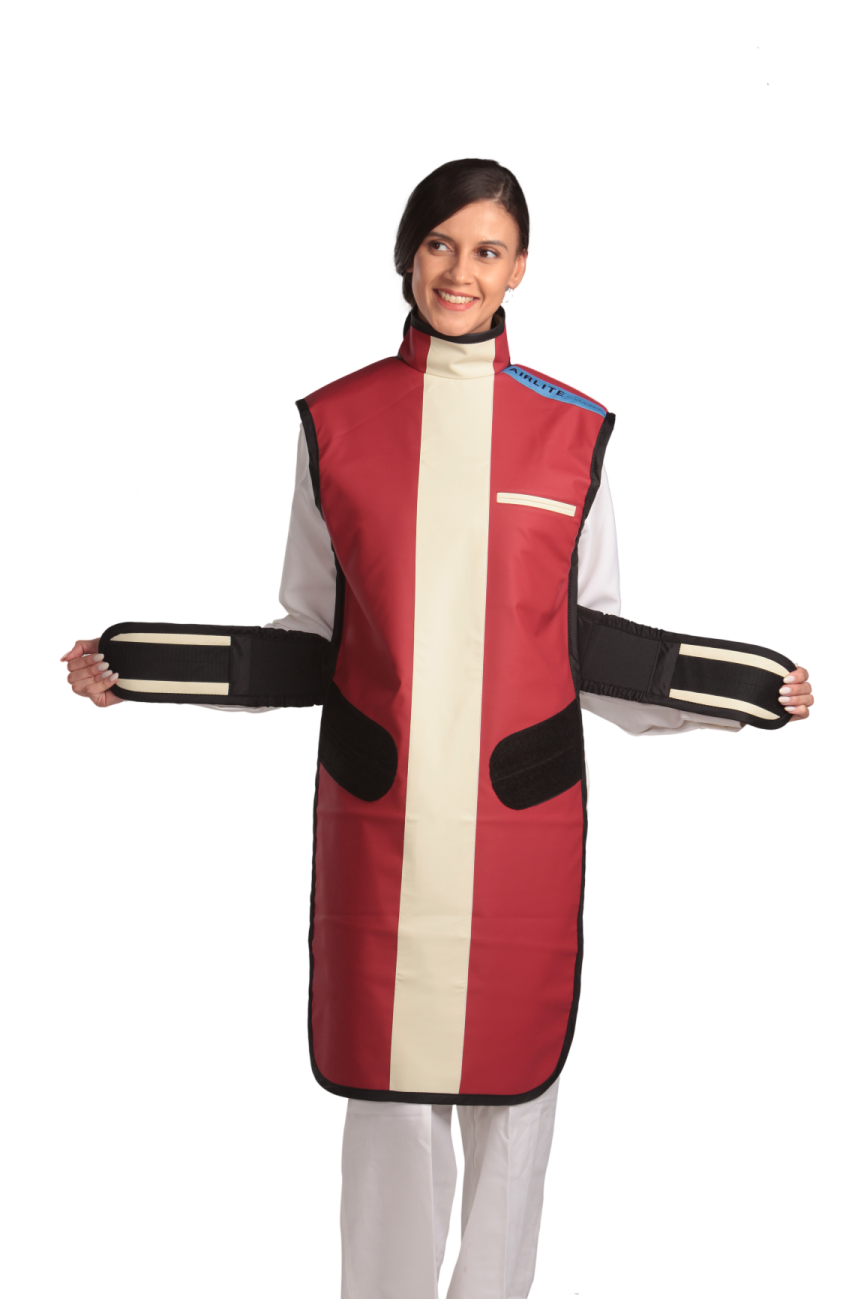 Ankle-length frontal view of a female model wearing a coat apron with integrated thyroid guard. The apron is Bordeaux red in color with a beige center line and has unfastened velcro fasteners held in the model's hands.