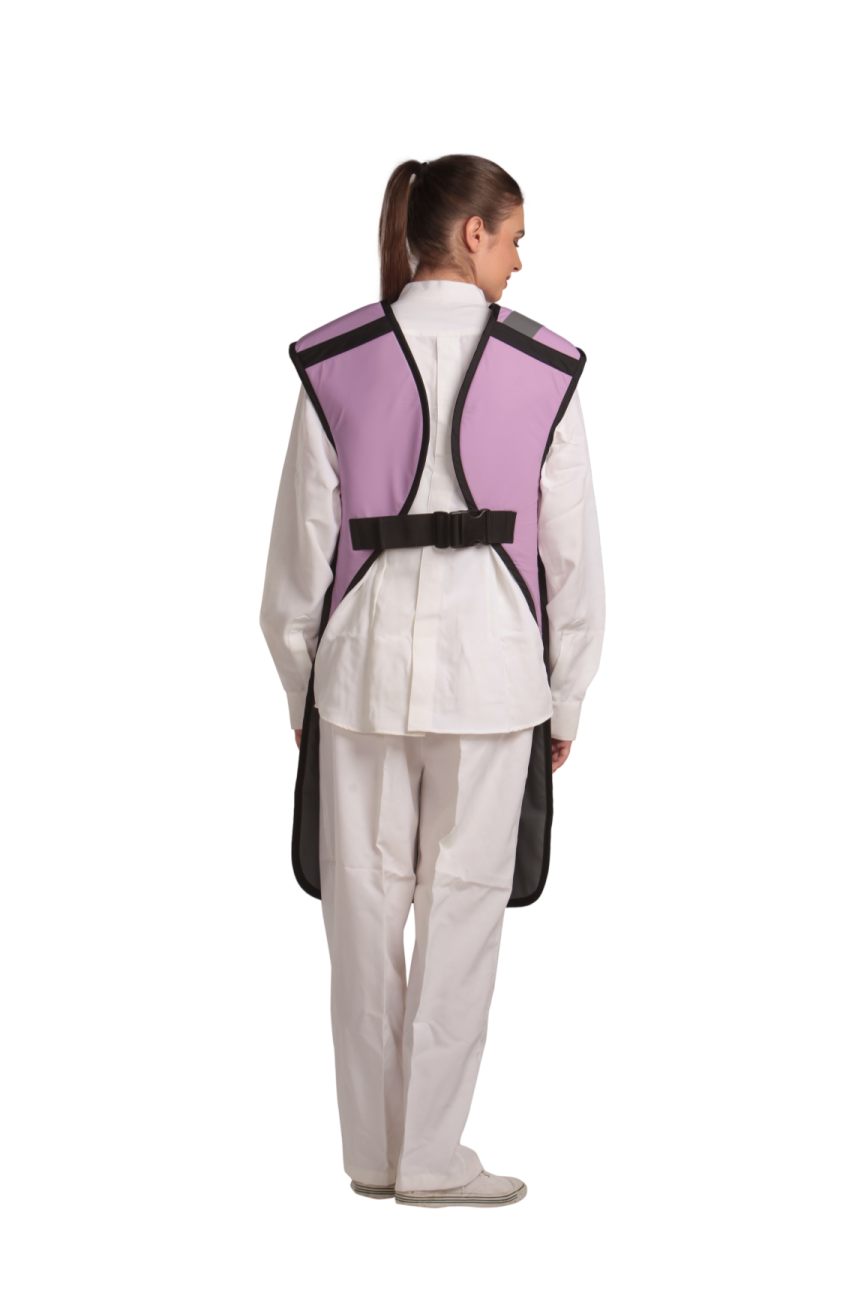 Back view of a female model wearing a lilac coat apron with flex back. 