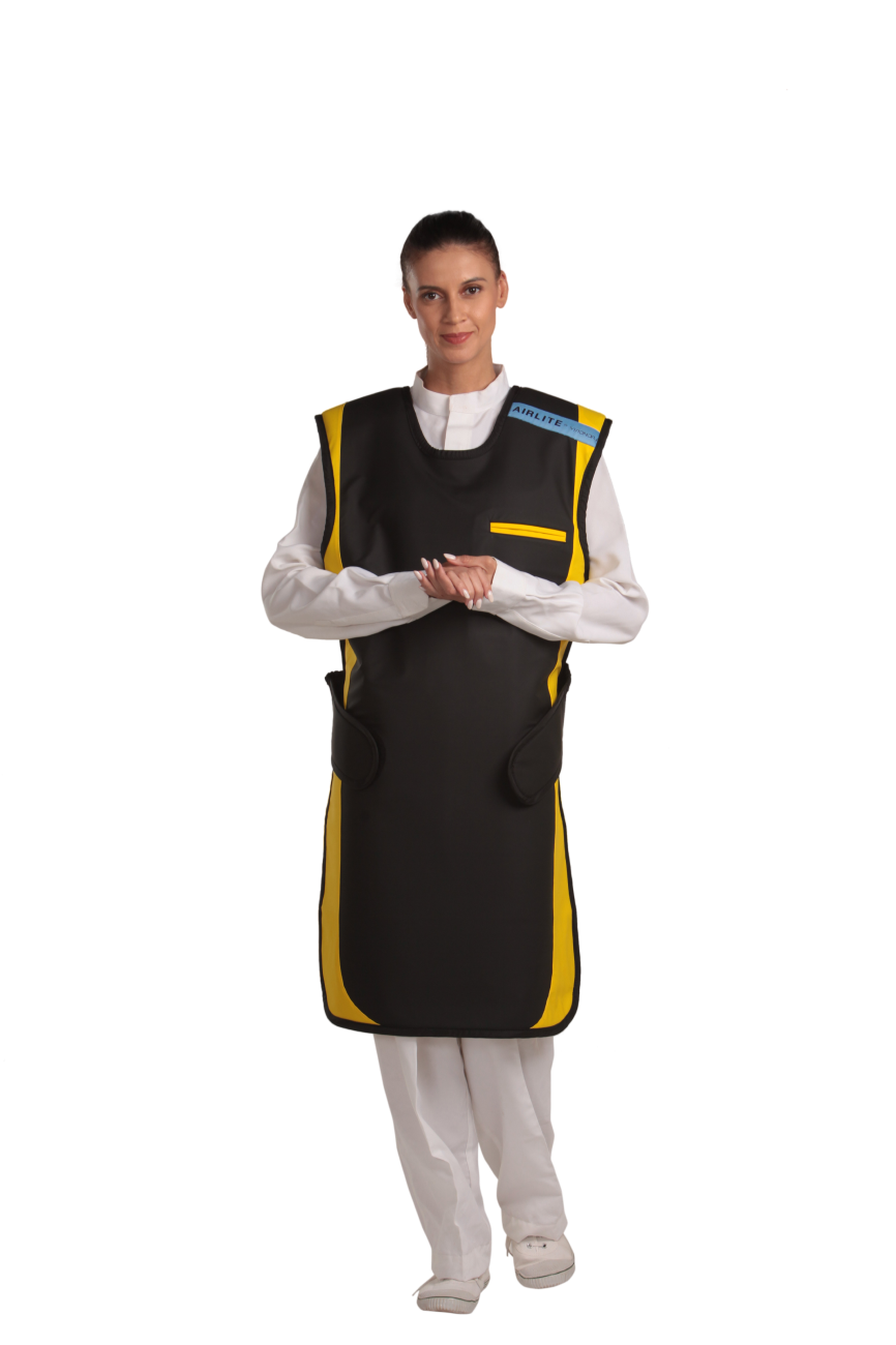 A full frontal view of a female model, her two hands clasped together below her chest, wearing a jet black, yellow-lined coat apron with flex back 