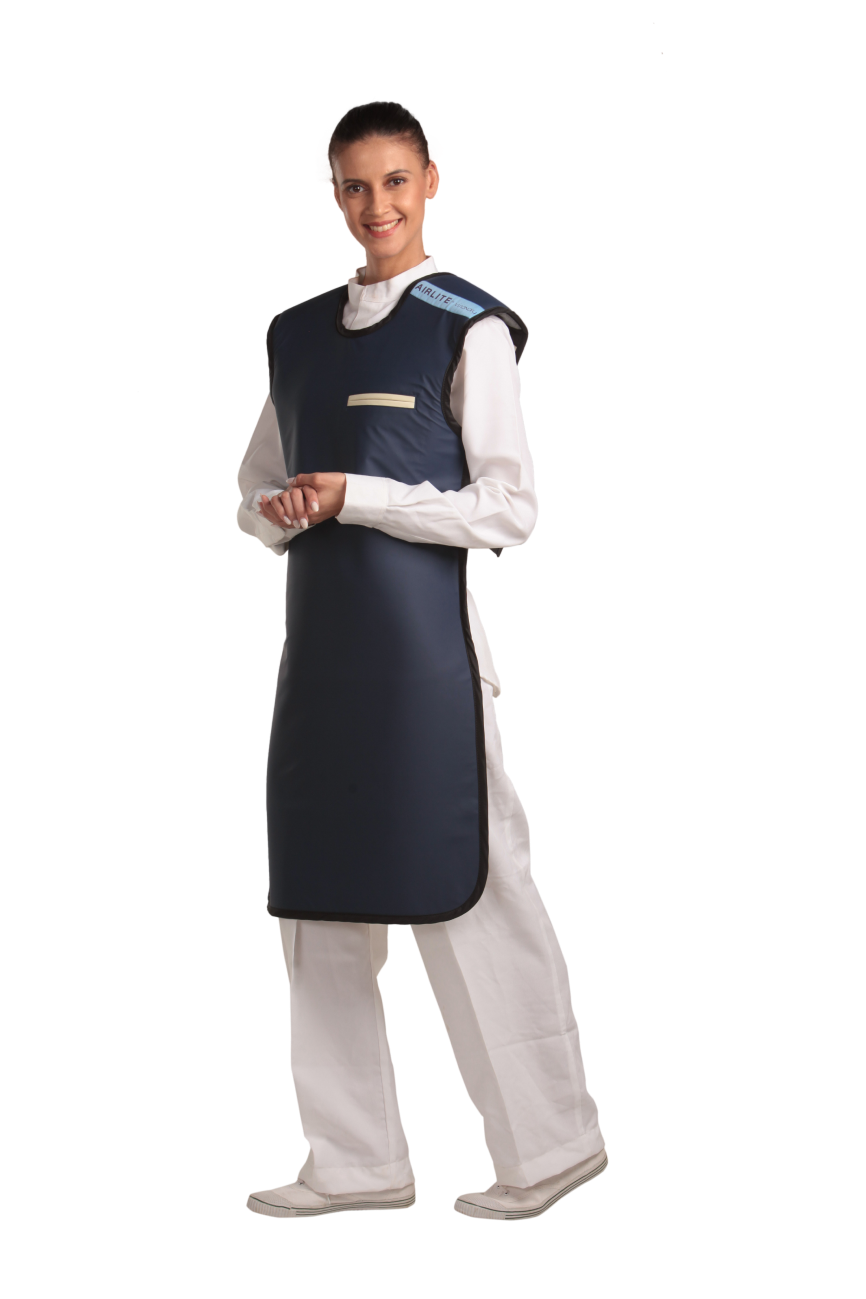 A partial frontal view of a female model wearing a navy blue, beige-lined coat apron with flex back. Her hands are clasped below her chest 