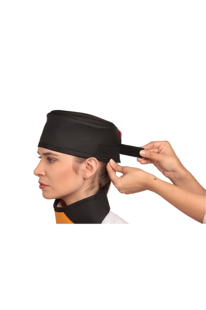 Up-close view of a black radiation protection head shield being fastened onto the head of a female model. 