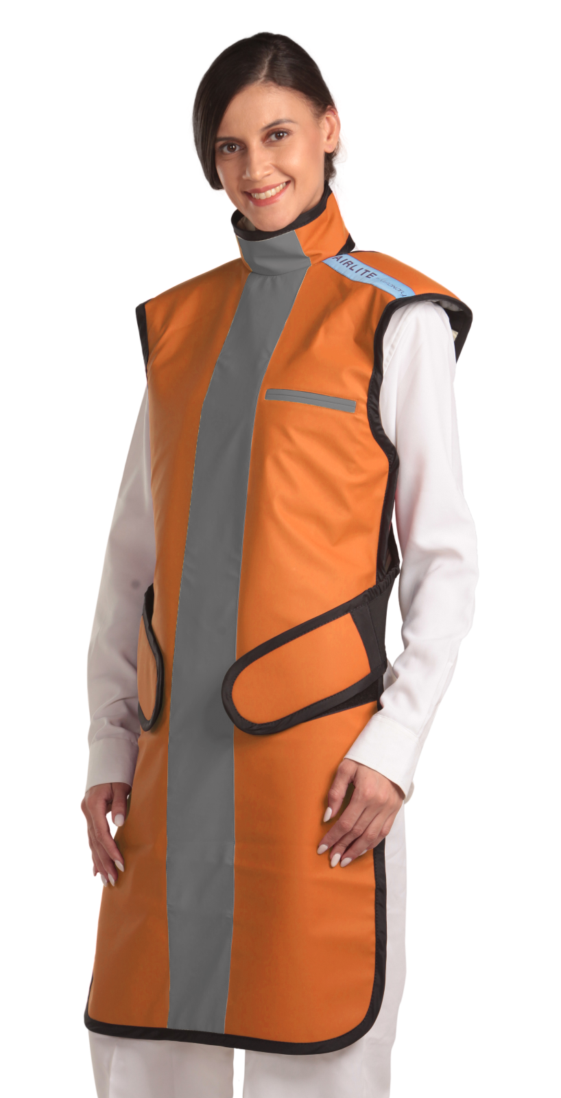 Frontal left-side view of a female model wearing a coat apron with an integrated thyroid guard. The apron is orange with a grey-colored center line and has velcro fasteners by the sides.
